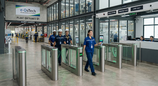 Enterprise industrial plant entrance equipped with modern stainless steel biometric turnstiles